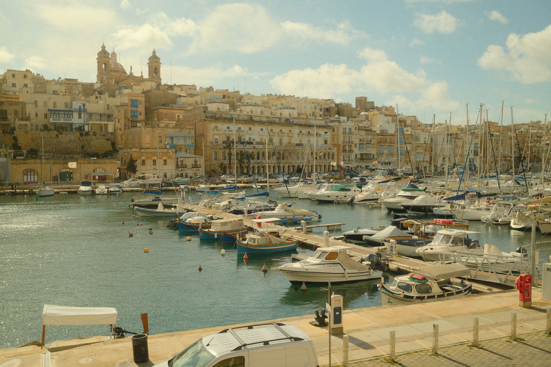 picturesque view of malta harbor with boats docked